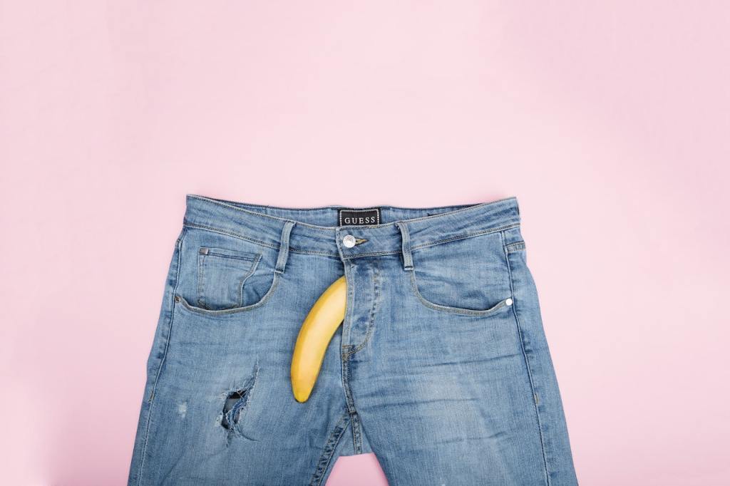 Photo by Deon Black: https://www.pexels.com/photo/blue-denim-jeans-on-the-table-6376544/

Banana hanging out of the fly of a pair of jeans as if it is a penis